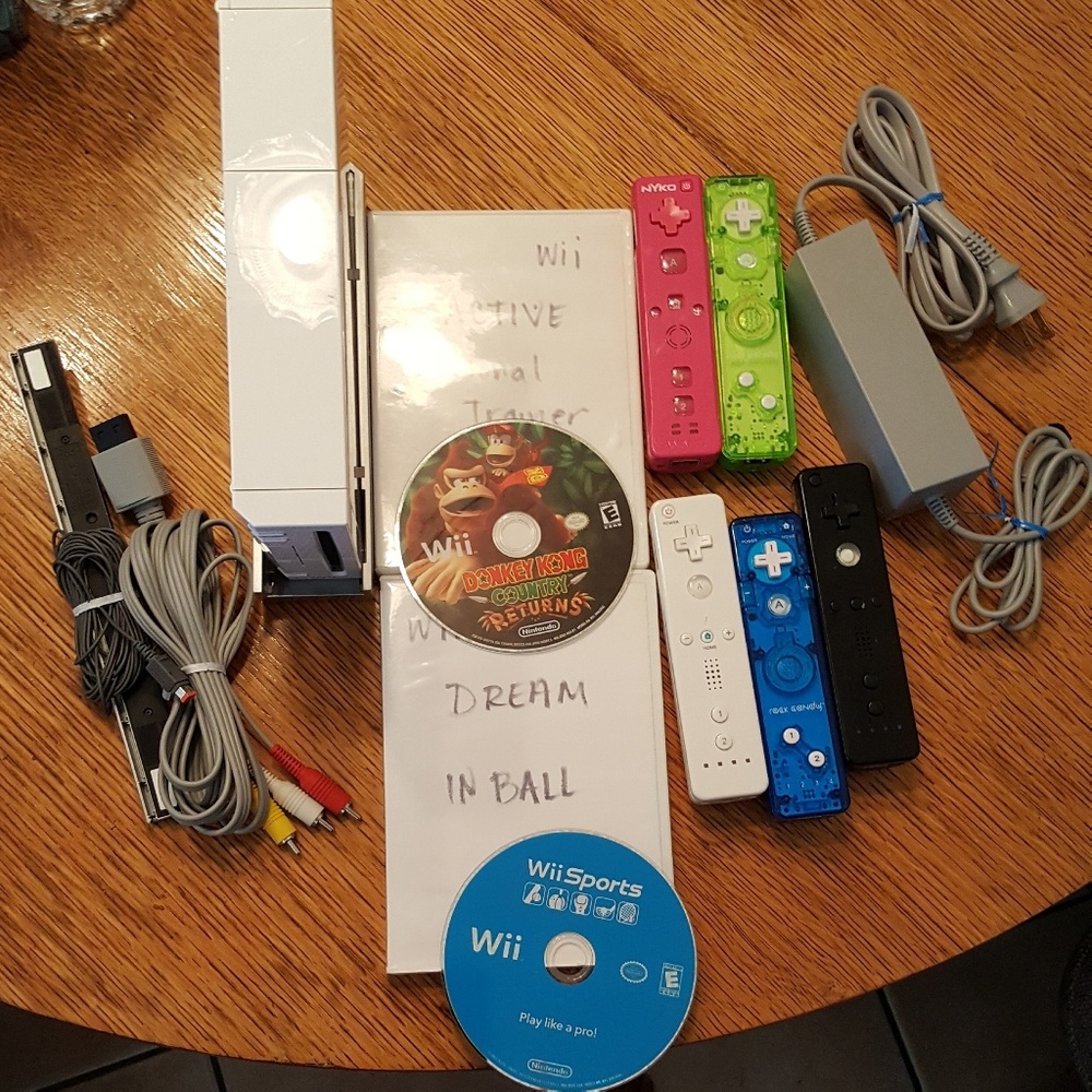 Wii Console, 36 games, 3 guitar, and 5 controller